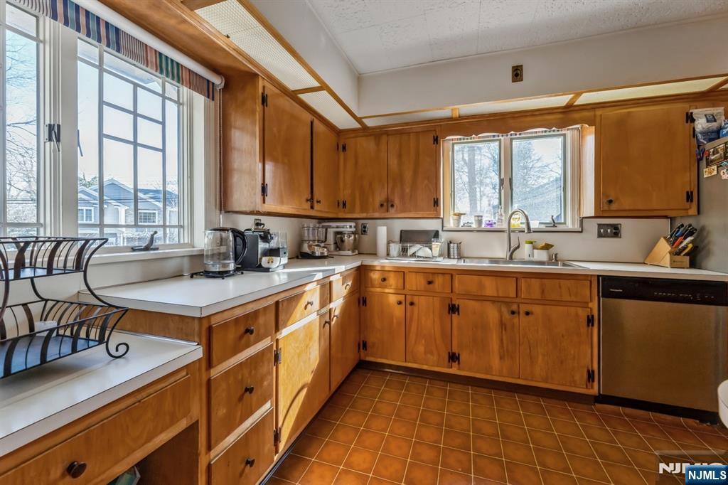 58 Taillon Terrace Closter, NJ 07624 - Photo 6 of 24 a kitchen with stainless steel appliances granite countertop a sink stove and cabinets