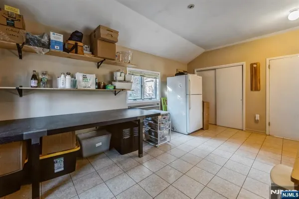 a view of a storage & utility room with cabinets