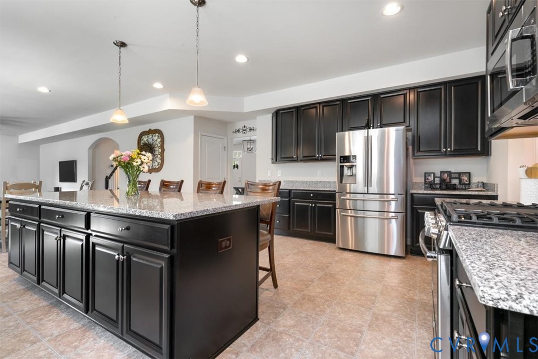 10430 Eagle Court Hopewell, VA 23860 - Photo 18 of 45 a kitchen with stainless steel appliances granite countertop a sink refrigerator and cabinets