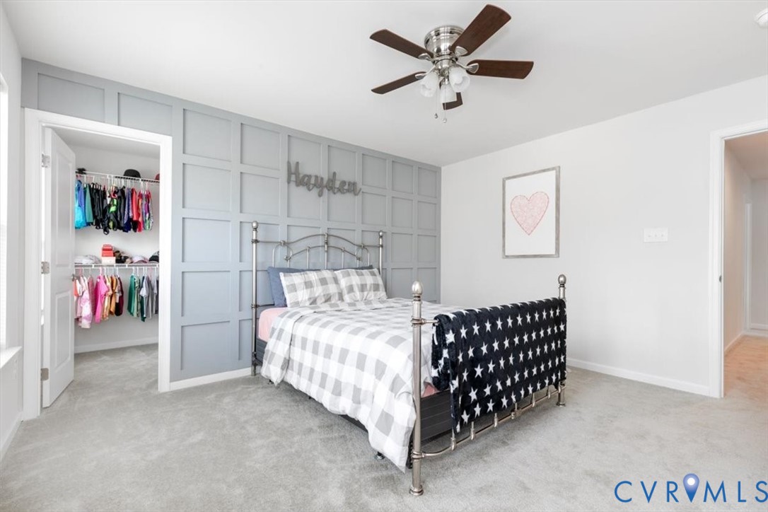 10430 Eagle Court Hopewell, VA 23860 - Photo 25 of 45 a bedroom with a bed and a chandelier