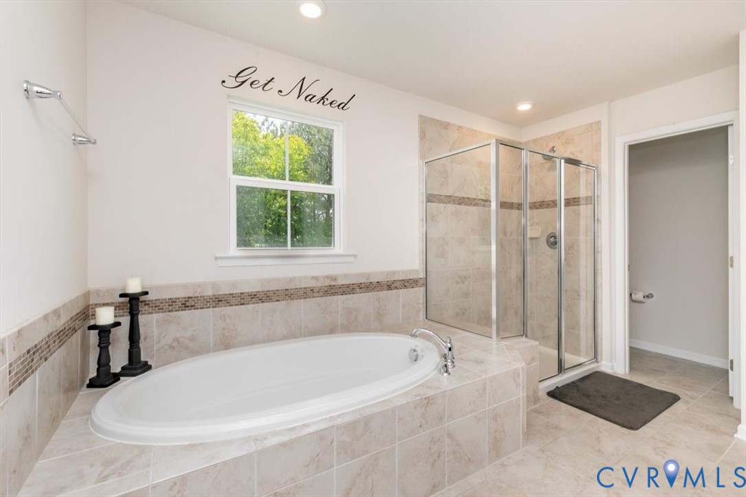 10430 Eagle Court Hopewell, VA 23860 - Photo 32 of 45 a white bath tub sitting next to a window