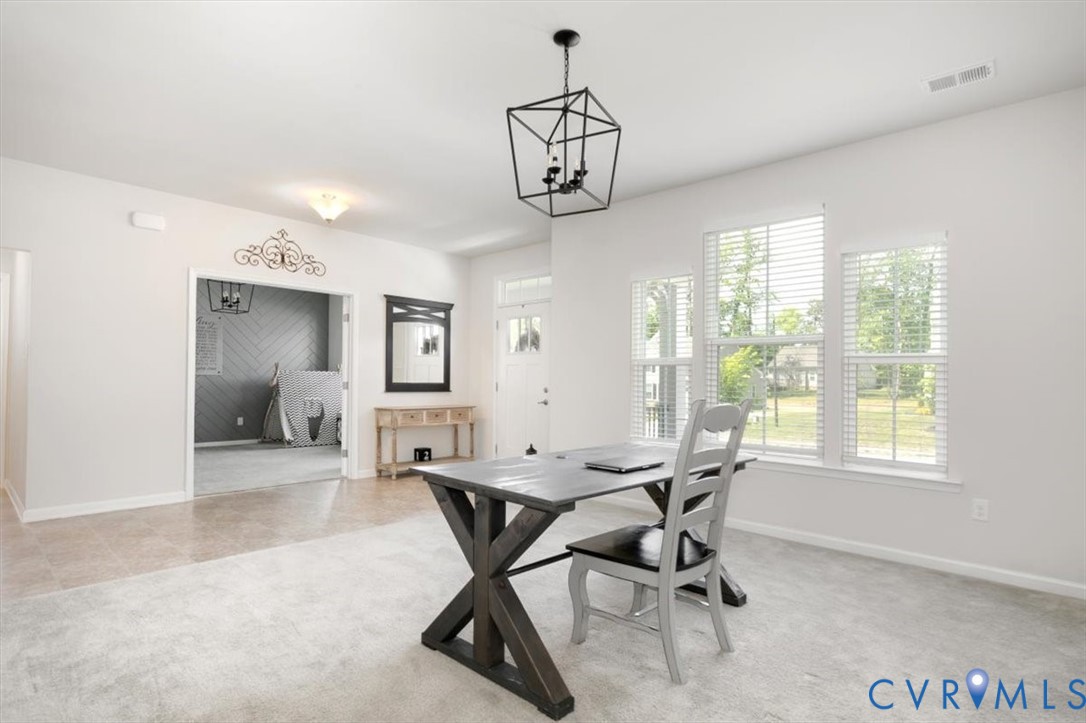 10430 Eagle Court Hopewell, VA 23860 - Photo 7 of 45 a workspace with chandelier and a window