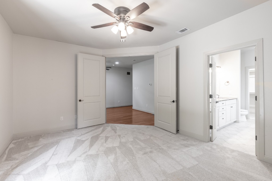 2310 Thornton Road, Unit A Austin, TX 78704 - Photo 19 of 32 a view of a big room with wooden floor and chandelier fan