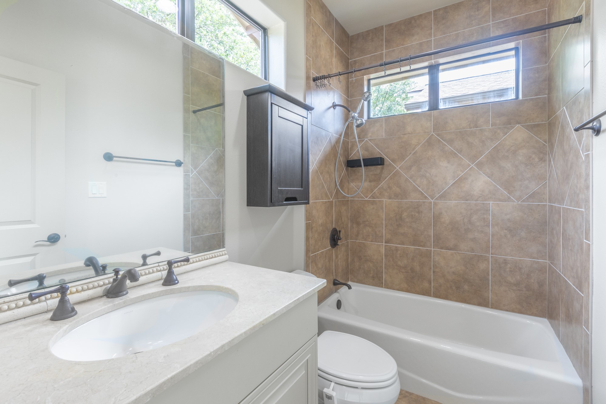 2310 Thornton Road, Unit A Austin, TX 78704 - Photo 25 of 32 a bathroom with a sink toilet and shower