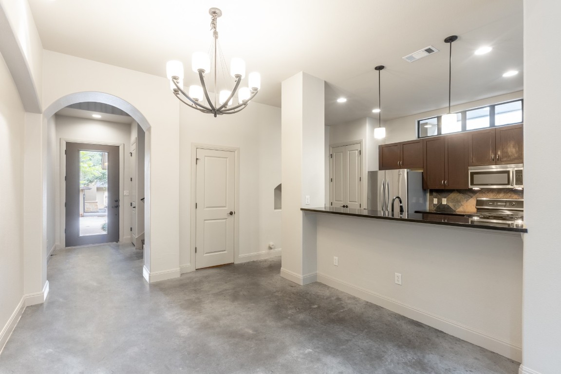 2310 Thornton Road, Unit A Austin, TX 78704 - Photo 5 of 32 a view of a kitchen with a sink and refrigerator