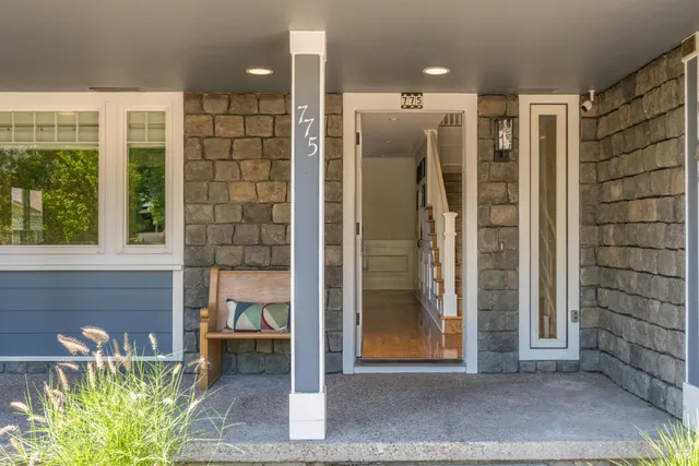 a view of a hallway with wooden shelves