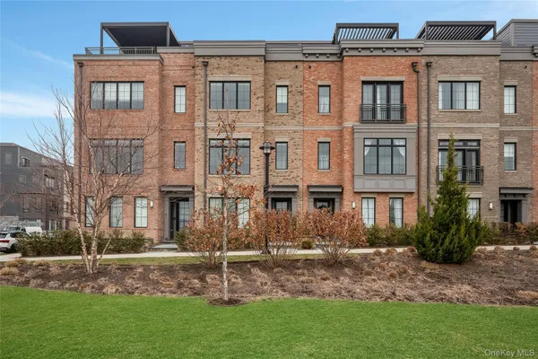a terrace of a house with outdoor seating