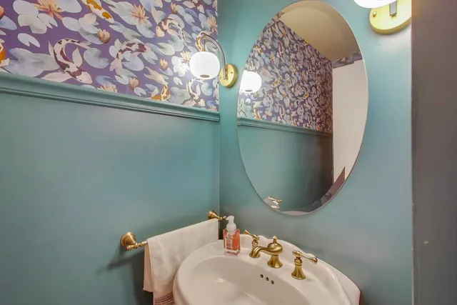a bathroom with a sink and mirror