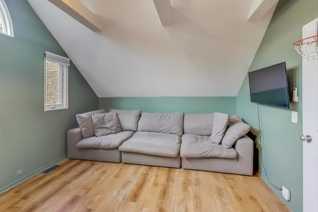 a living room with a couch and a flat screen tv