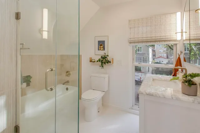 a bathroom with a shower and a tub
