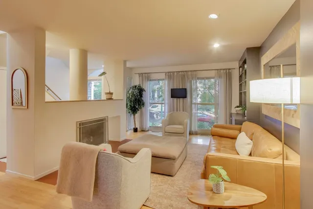 a living room with furniture and a fireplace