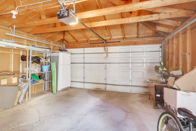 a front view of a house with outdoor seating