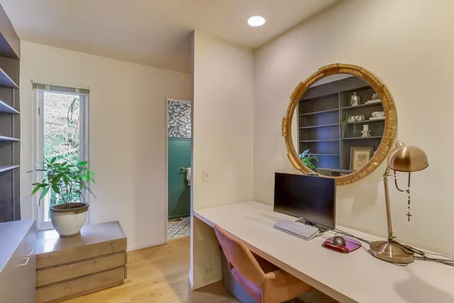 a workspace with furniture and window