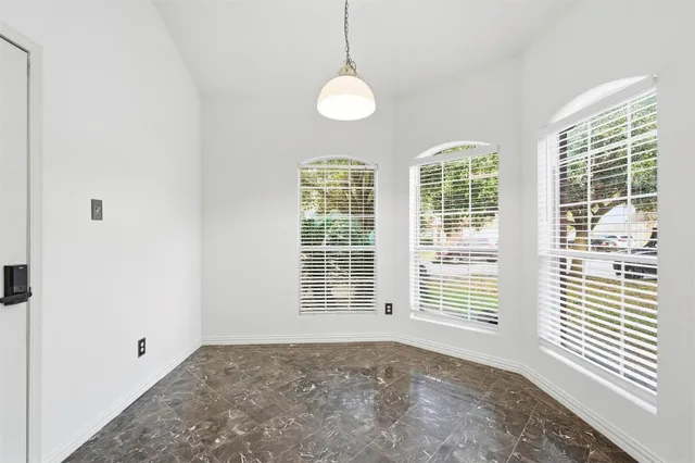 a view of kitchen and windows