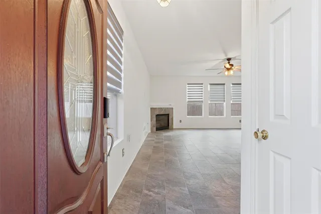 a view of an empty room with a window