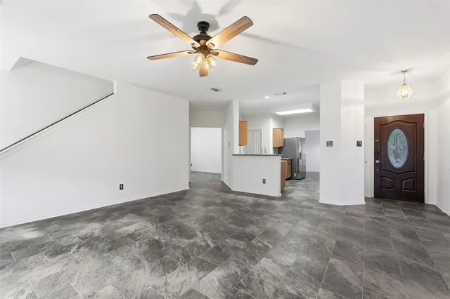 a view of a livingroom with a ceiling fan