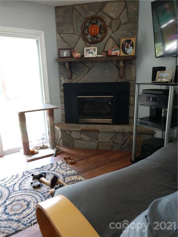 660 McCracken Farm Road Clyde, NC 28721 - Photo 8 of 13 a living room with furniture and a fireplace