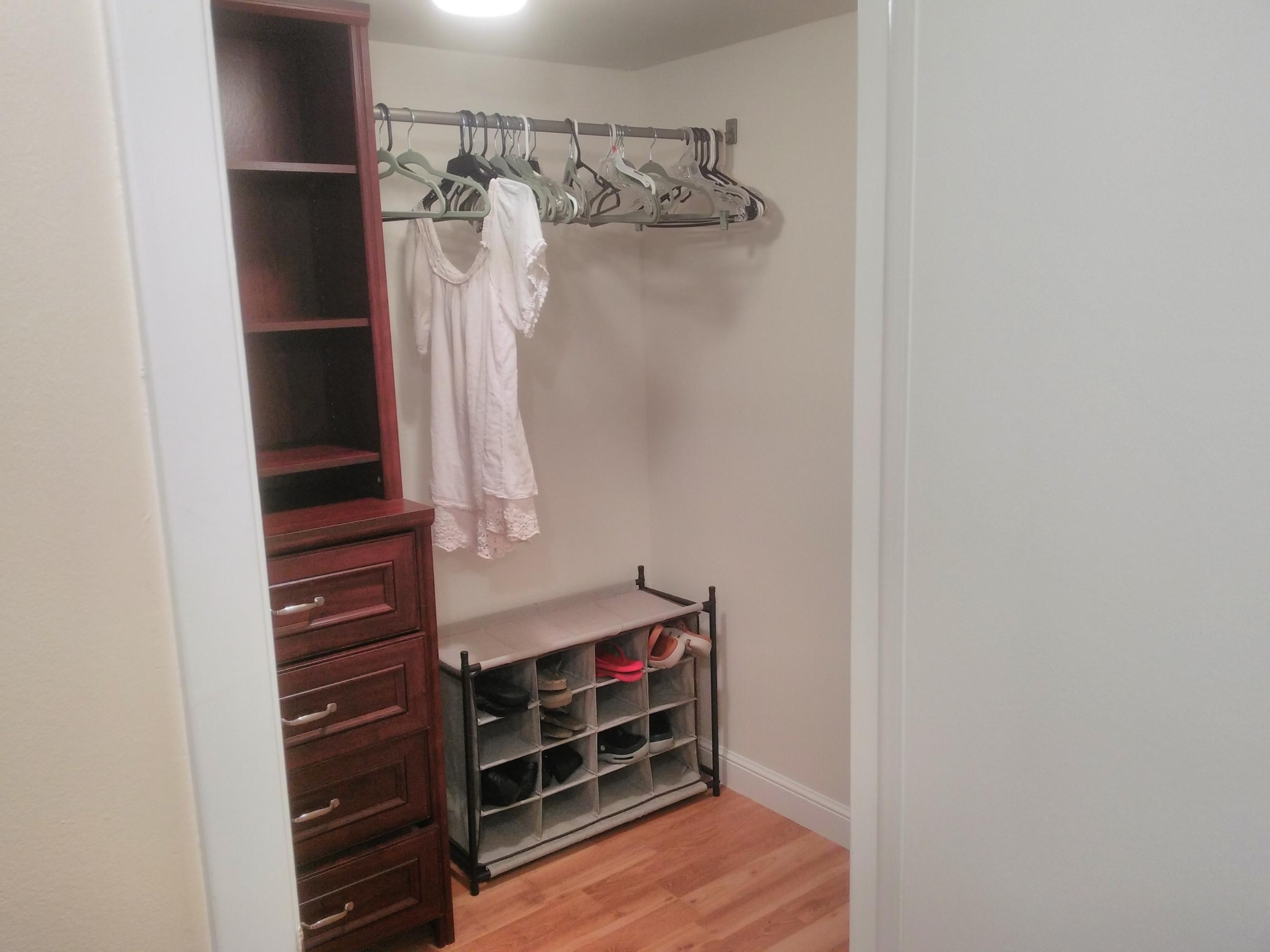 3465 Via Poinciana, Unit 806 Lake Worth, FL 33467 - Photo 11 of 22 a view of walk in closet with clothes and shoes