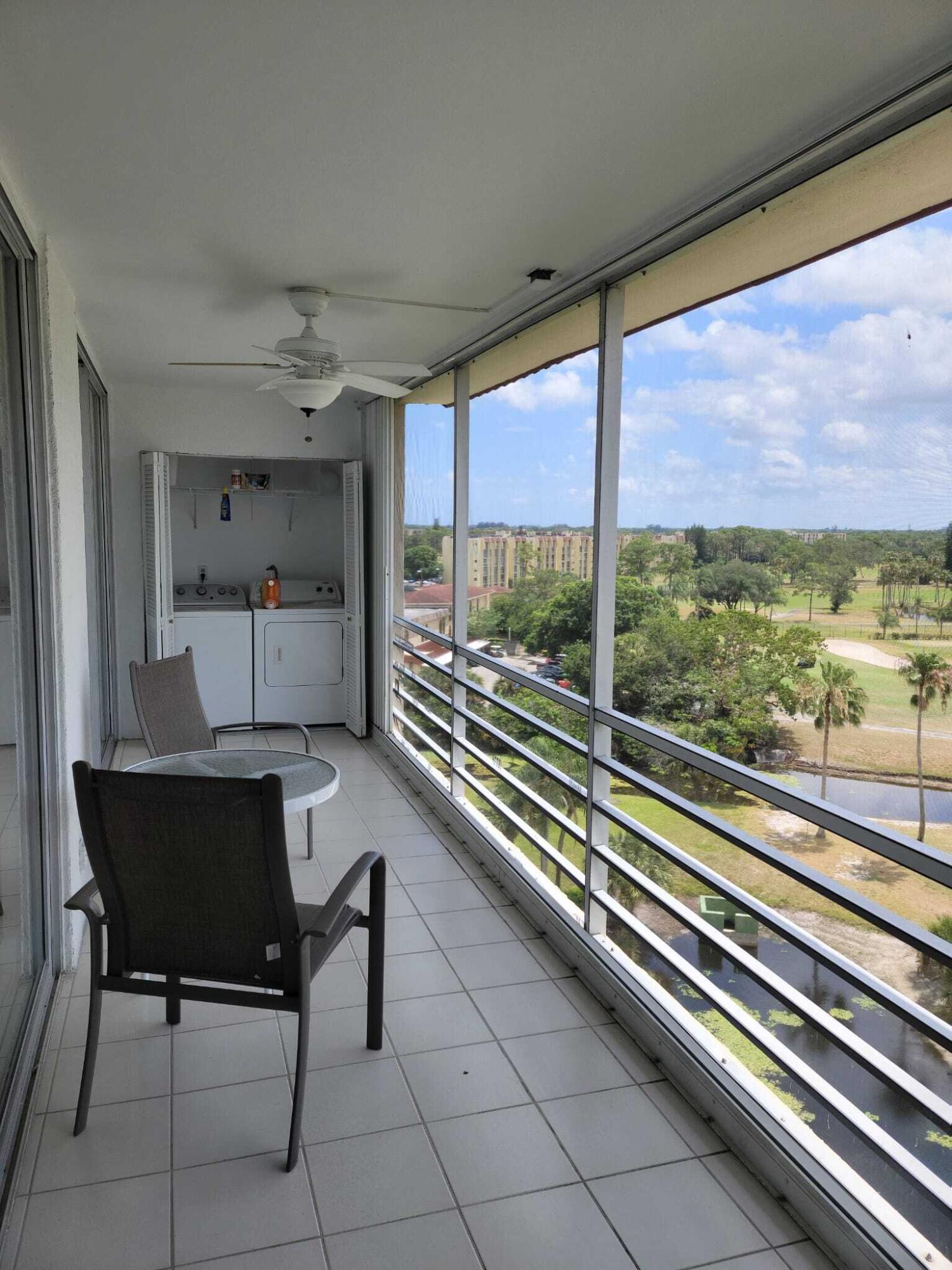 3465 Via Poinciana, Unit 806 Lake Worth, FL 33467 - Photo 19 of 22 a view of a room with furniture and a large window