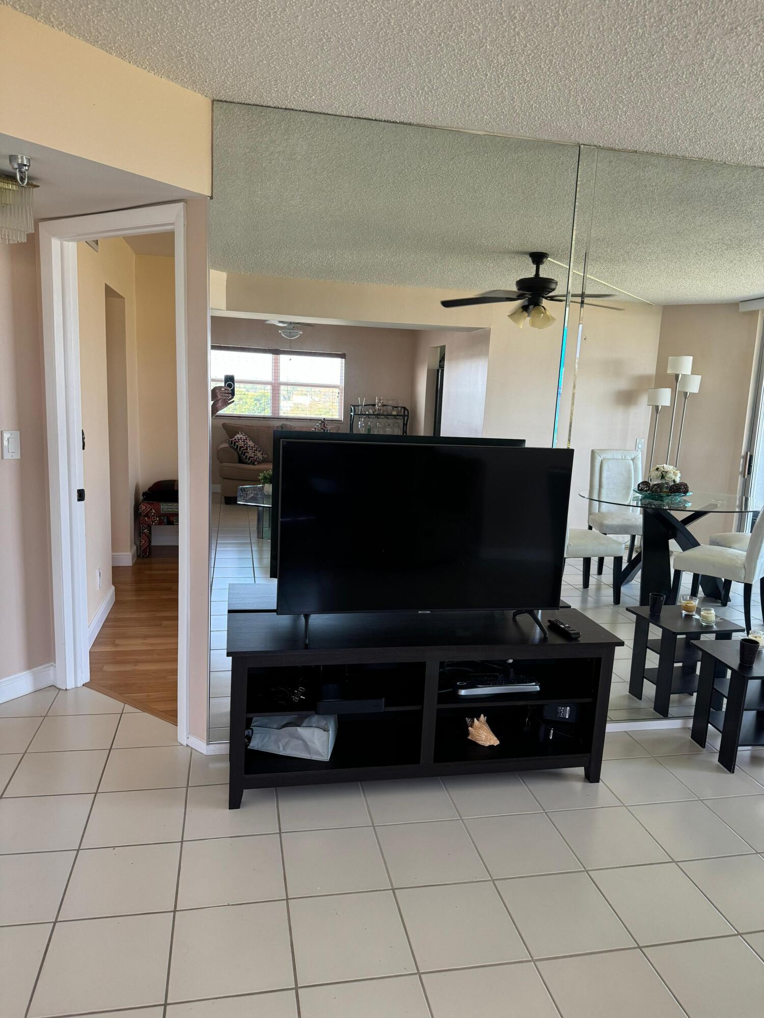 3465 Via Poinciana, Unit 806 Lake Worth, FL 33467 - Photo 5 of 22 a living room with furniture and a flat screen tv