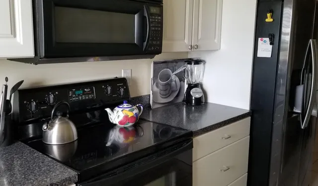 a kitchen with a stove and a microwave