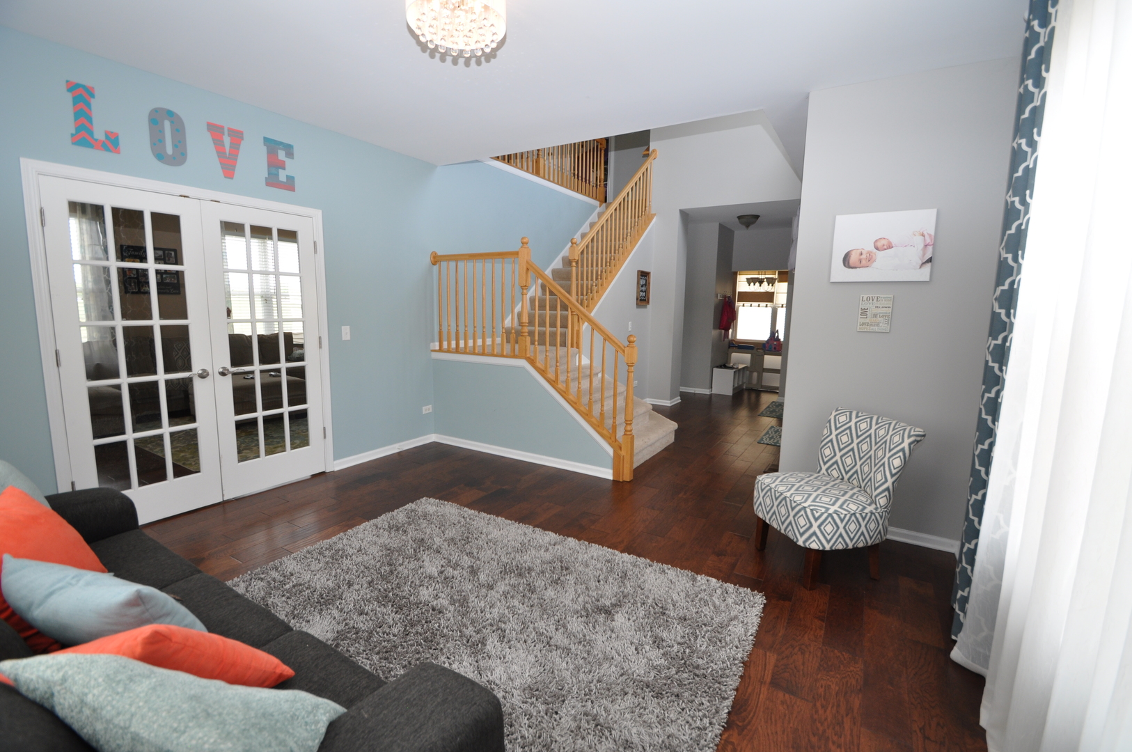 25056 Spring Street Manhattan, IL 60442 - Photo 3 of 24 a view of entryway and livingroom with wooden floor