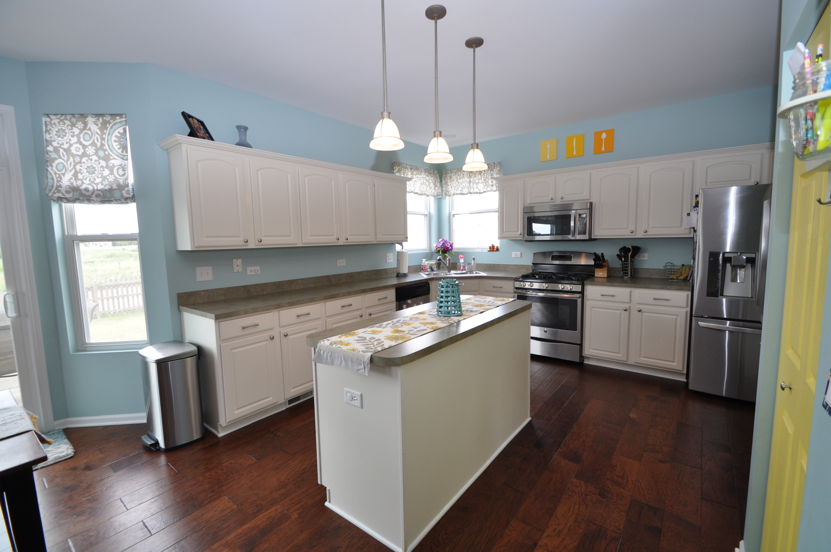 25056 Spring Street Manhattan, IL 60442 - Photo 9 of 24 a kitchen with granite countertop a sink cabinets stainless steel appliances and a window