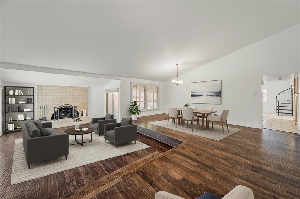 6639 Roundrock Road Dallas, TX 75248 - Photo 1 of 1 a living room with furniture and wooden floor
