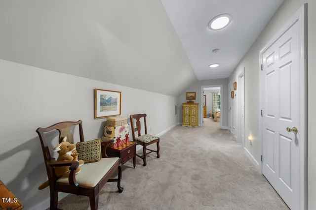 a view of a livingroom with furniture and a window