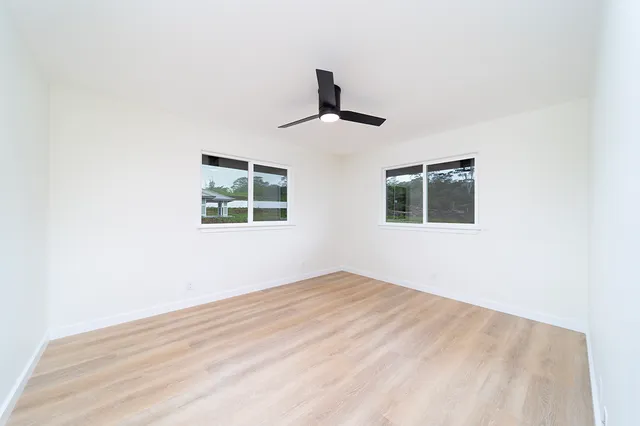 a view of empty room with windows