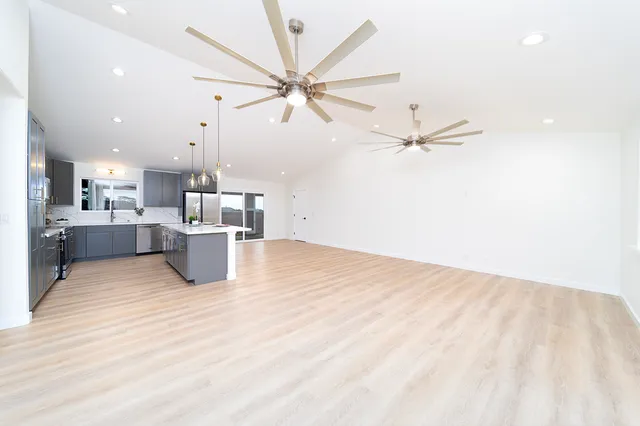 a view of a kitchen with a sink and cabinets