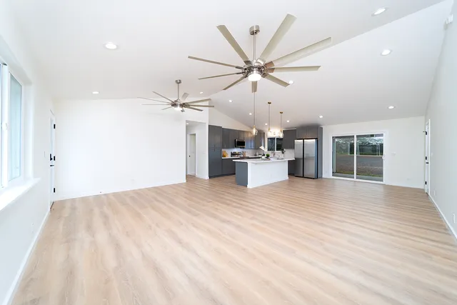 a view of a kitchen with a sink and a window