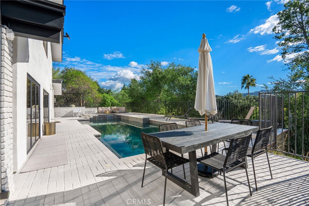 23229 8th Street Newhall, CA 91321 - Photo 11 of 52 a view of backyard with swimming pool and outdoor seating