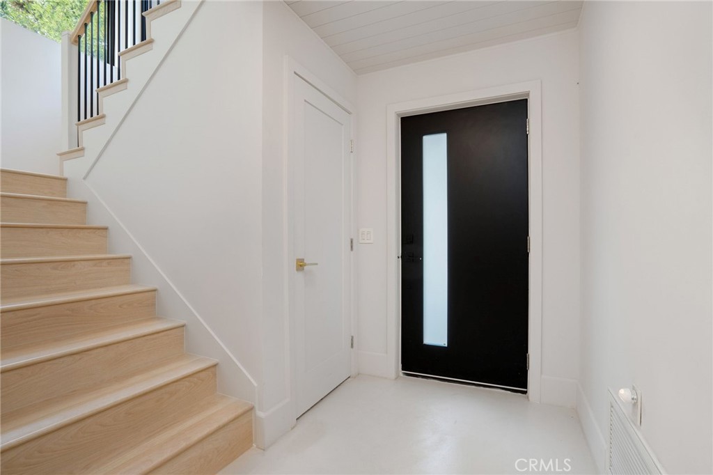 23229 8th Street Newhall, CA 91321 - Photo 16 of 52 a view of an entryway with staircase