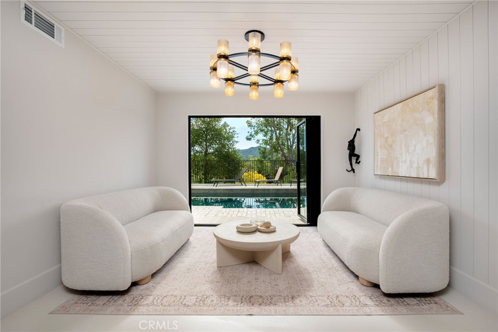23229 8th Street Newhall, CA 91321 - Photo 19 of 52 a living room with furniture a rug and a window