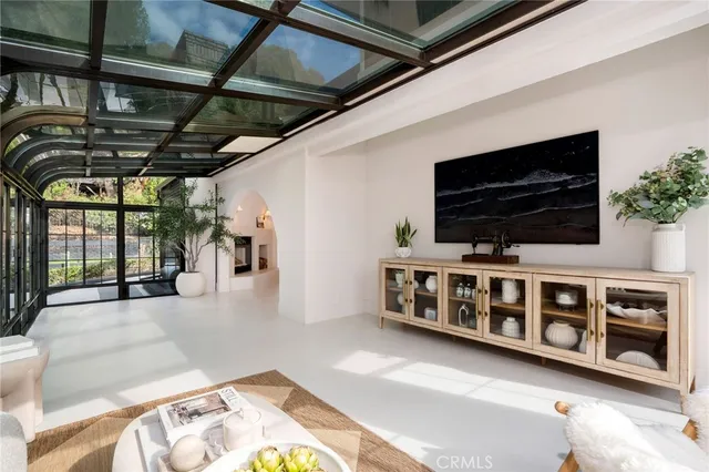 a kitchen with a sink window and cabinets