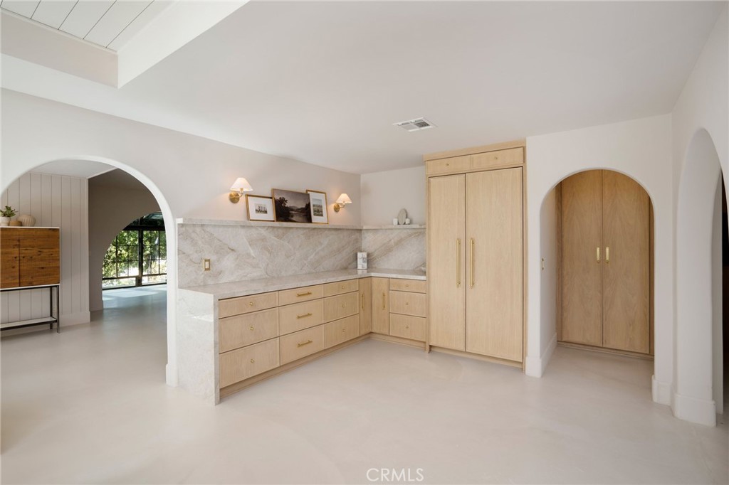 23229 8th Street Newhall, CA 91321 - Photo 25 of 52 a view of a kitchen with a sink and cabinet with wooden floor