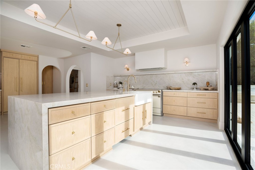 23229 8th Street Newhall, CA 91321 - Photo 26 of 52 a view of a kitchen with white cabinets
