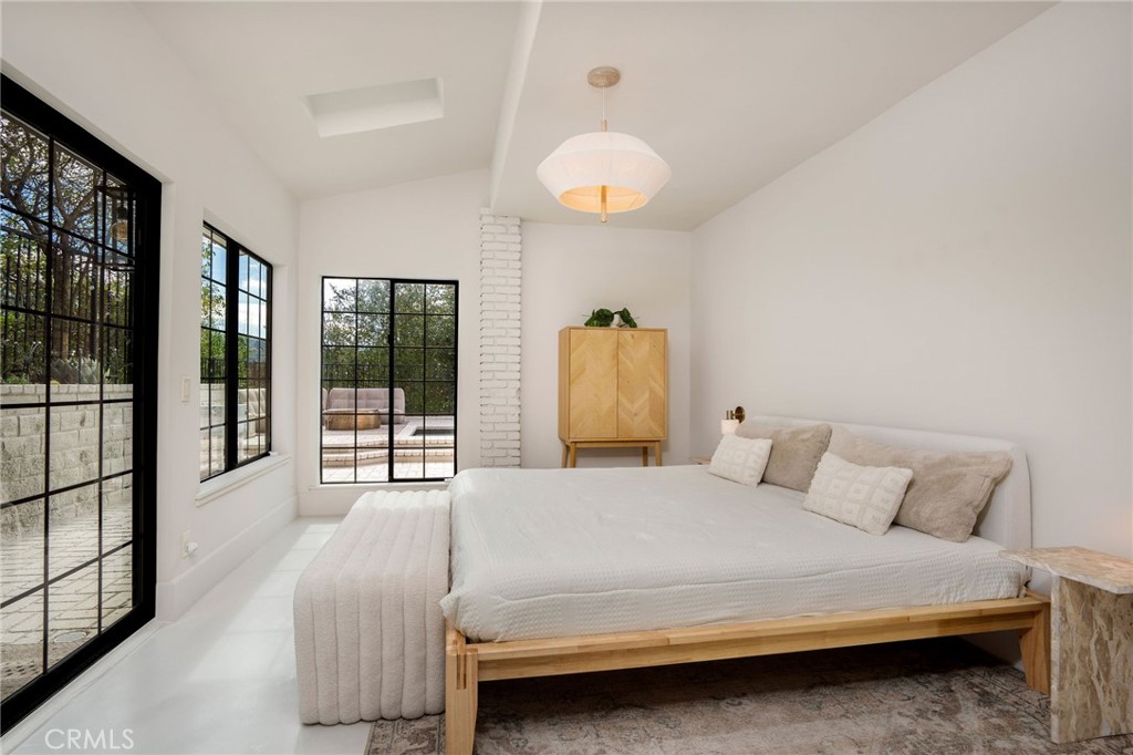 23229 8th Street Newhall, CA 91321 - Photo 28 of 52 a bedroom with a bed and a large window
