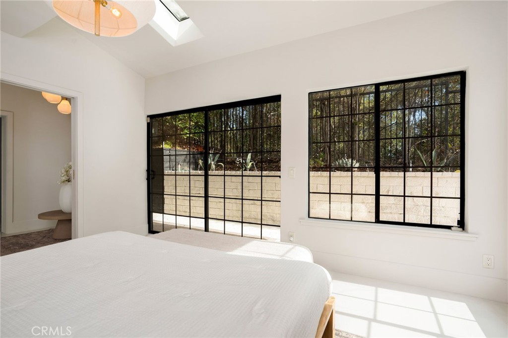 23229 8th Street Newhall, CA 91321 - Photo 29 of 52 a bedroom with a bed and a window