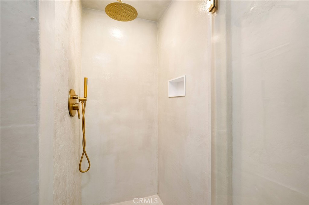 23229 8th Street Newhall, CA 91321 - Photo 31 of 52 a bathroom with a shower