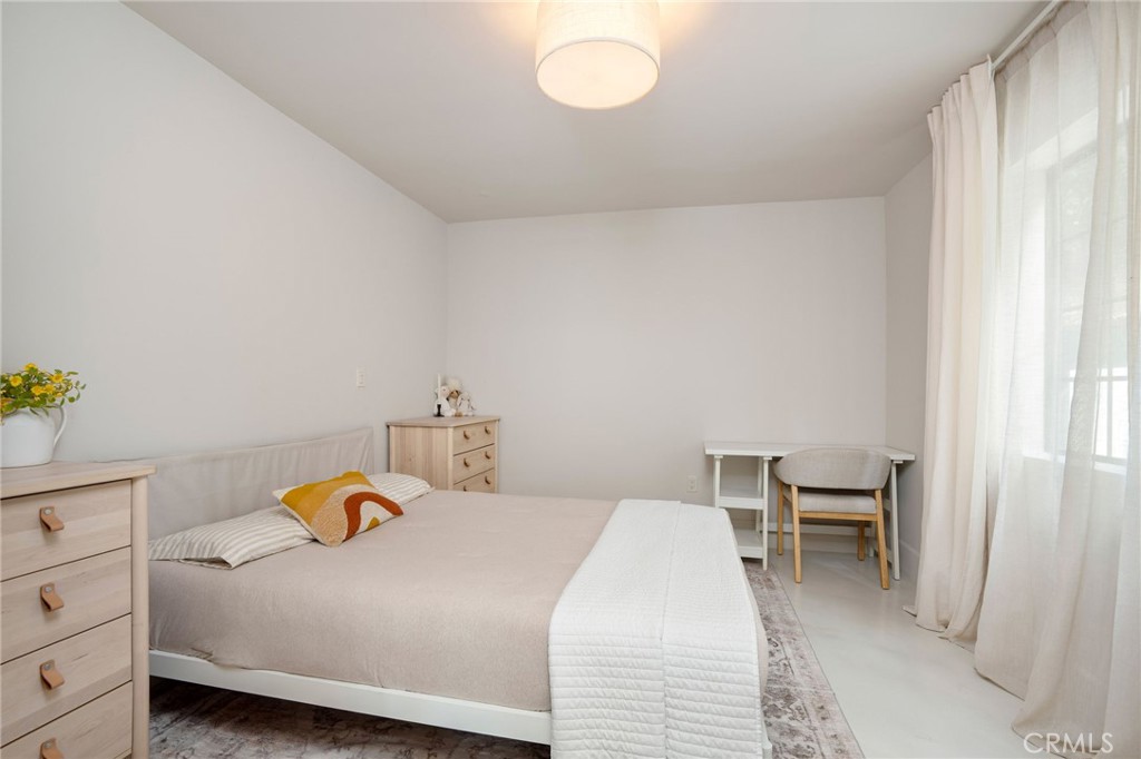 23229 8th Street Newhall, CA 91321 - Photo 32 of 52 a bedroom with a bed and a window