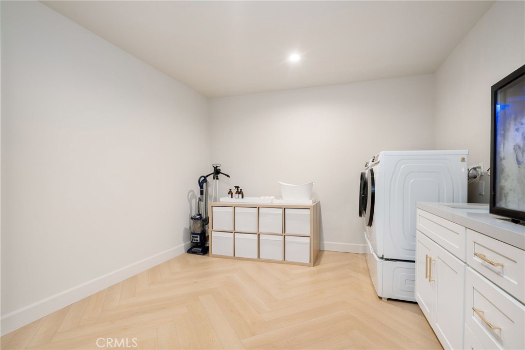 23229 8th Street Newhall, CA 91321 - Photo 36 of 52 a bed room with a bed and a white wall