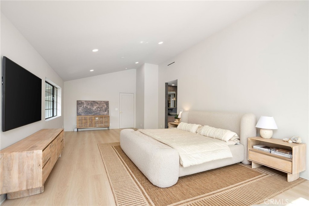 23229 8th Street Newhall, CA 91321 - Photo 38 of 52 a bedroom with a bed and a flat screen tv