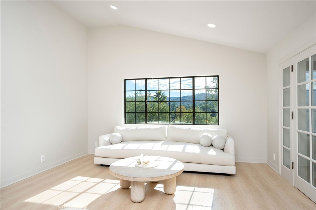 23229 8th Street Newhall, CA 91321 - Photo 39 of 52 a living room with furniture and a large window
