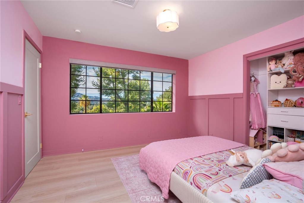 23229 8th Street Newhall, CA 91321 - Photo 47 of 52 a bedroom with a bed and a window