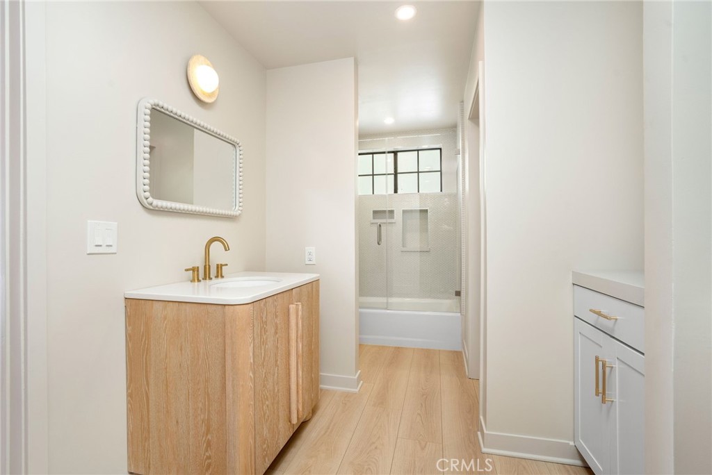 23229 8th Street Newhall, CA 91321 - Photo 48 of 52 a bathroom with a sink a toilet and shower