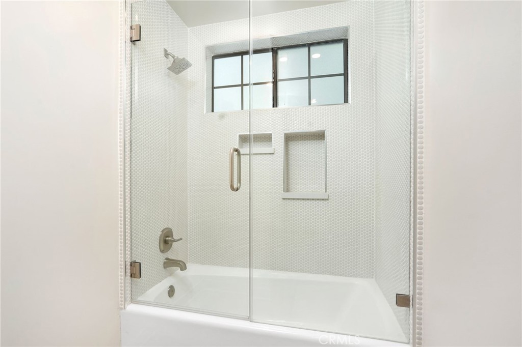 23229 8th Street Newhall, CA 91321 - Photo 50 of 52 a white bath tub sitting next to a shower