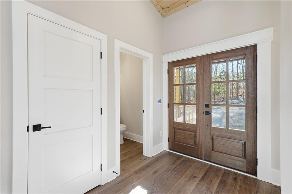 1176 Jewel Court Northeast Ranger, GA 30734 - Photo 3 of 53 an empty room with wooden floor and windows