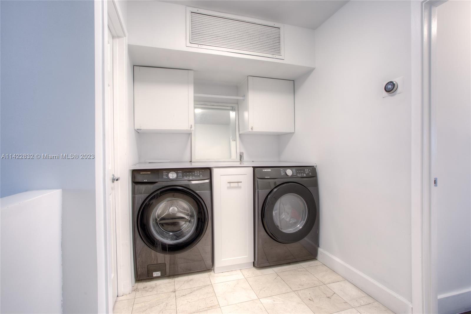 14332 Southwest 97th Lane Miami, FL 33186 - Photo 8 of 15 a view of washer and dryer in a utility room